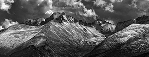 After a fresh covering of snow, Long's Peak emerges from the clouds after a storm over Rocky Mountain National Park. - Colorado Black and White Photograph