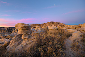 Scenic landscape photograph of a moonset over Toadstool Geologic Park in western Nebraska. - Nebraska Photograph