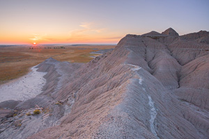 The sun rises over the western Nebraska plains from atop a ridge in Toadstool Geologic Park. - Nebraska Photograph