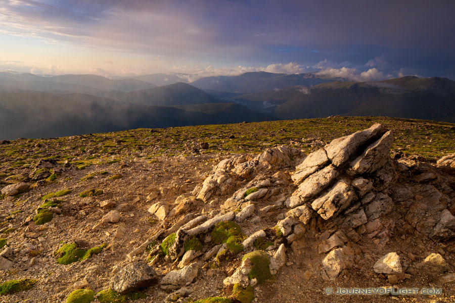 High upon the tundra, fog rolls through as the sun begins to set over the Never Summer Range in Rocky Mountain National Park. - Colorado Photography