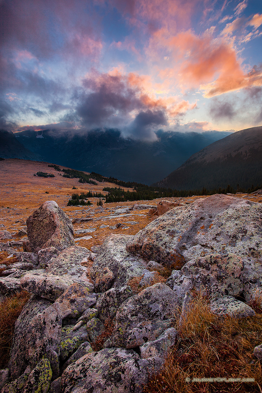 There was a chill in the air as evening descended across Rocky Mountain National Park.  From the treeless tundra, the view of the valley was uninhibited while the clouds rolled across the tips of the mountains.  It is during these times I fully comprehend the feelings described by John Denver in his songs. - Colorado Picture