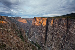 Sunlight illuminates the walls of the Black Canyon of the Gunnison just after sunrise. - Colorado Landscape Photograph