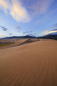A rare combination of geologic forces combine to create these massive dunes, the largest in North America.  Rising in the distance is Mt. Herard, one of the tallest mountains of the San Juan range. - Colorado Landscape Photograph