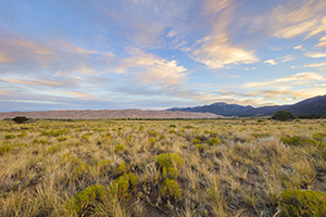 The sun rises over the Sangre De Cristo Range and the Great Sand Dunes. - Colorado Landscape Photograph