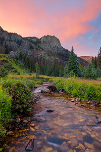 A scenic photograph of Tonahutu creek and a sunset at Rocky Moutain National Park, Colorado. - Colorado Landscape Photograph