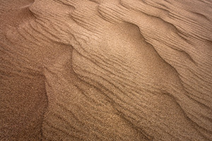 At Great Sand Dunes National Park and Preserve, intricate patterns arise in the sand from the wind blowing one direction and then another. - Colorado Abstract Photograph Photograph
