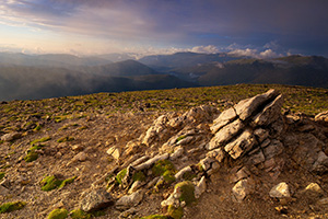 High upon the tundra, fog rolls through as the sun begins to set over the Never Summer Range in Rocky Mountain National Park. - Colorado Photograph