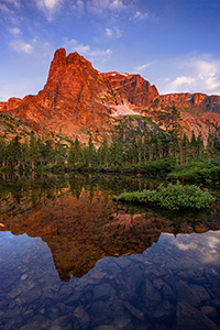 I had first hiked to Lake Helene about 5 years prior on a crisp fall day and on that visit became one of my favorite locations in Rocky Mountain National Park.  I took another opportunity to visit this scenic location, this time in the summer.  As the sun rose, Notchtop glowed with a brilliant warmth similar to what I had witnessed on the prior visit.  This year, however, the water was calm and reflected the beautiful scene that was before me. - Colorado Photograph