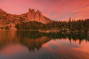 The warmth of a summer sunrise bathes Lake Nanita and Ptarmigan Mountain in a warm red glow. - Colorado Landscape Photograph Photograph