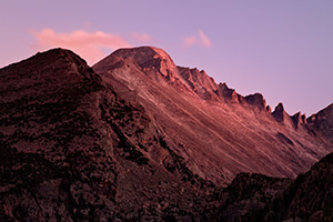 The last light of sunset emblazens Long's Peak with a crimson hue before dimming into night. - Colorado Photograph