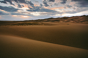 Near sunset the dunes appear to go to infinity. - Colorado Photograph