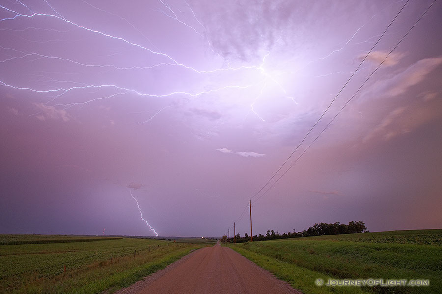 An intense lightning storm in rural eastern Nebraska lights up the sky with bolts extending in all directions. - Nebraska Photography