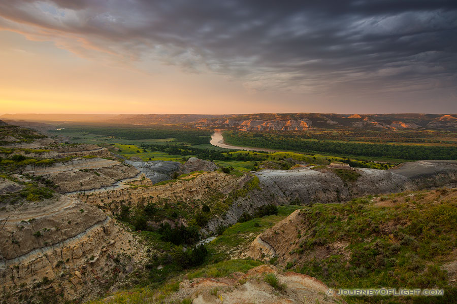 Sunlight streams across the Little Missouri valley in the North Unit of Theodore Roosevelt National Park, North Dakota. - North Dakota Photography