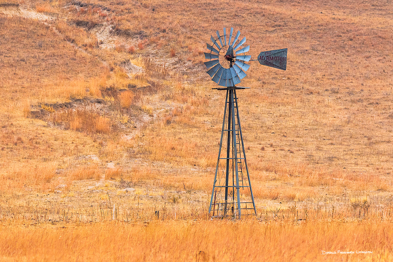 A scenic landscape photograph of a windmill in the sandhills of Nebraska. - Nebraska Picture