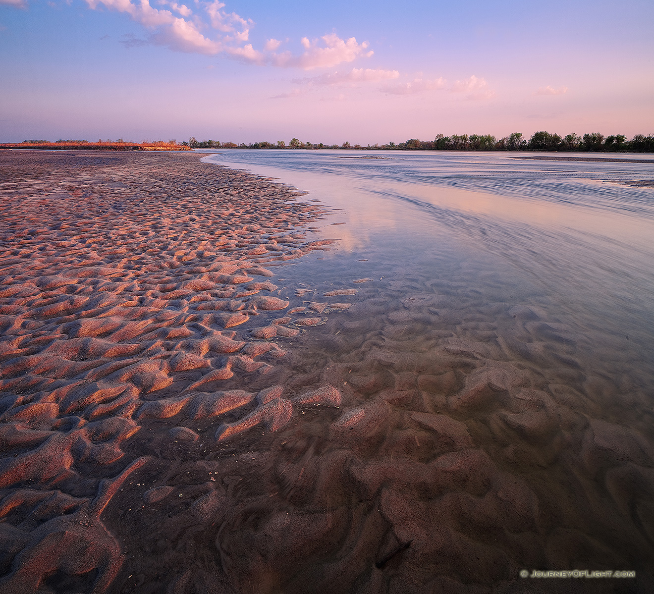 On a sandbar near Two Rivers State Recreation Area, the Platte River flows into the distance as the sun sets to the west. - Nebraska Picture