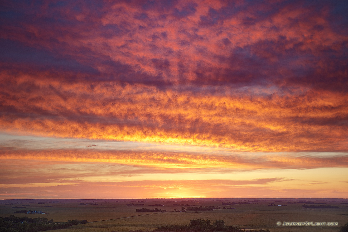 A beautiful sunrise crests over the distant farmland from the scenic overlook at Ponca State Park in Dixon County. - Nebraska Picture