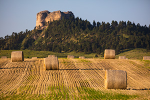 A Nebraska photograph of Hay Bales in the morning under Lovers Leap at Fort Robinson State Park. - Nebraska Photograph