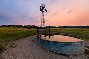 A Nebraska landscape scenic photograph of a windmill at sunset at Fort Robinson, Nebraska. - Nebraska Photograph