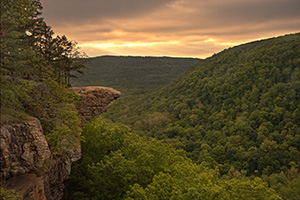 Rays of light illuminate the Ozarks at Whitaker Point while Hawksbill Crag juts out from the side of the hill.  Hills blanketed in verdant trees can be seen for miles around.</a><p>This image was featured in the 'Traveling the Journey of Light' Photoblog on May 13, 2010.  <a href='http://blog.journeyoflight.com/2010/05/13/a-story-from-the-field-illumination-at-whitaker-point-hawksbill-crag/' target=_blank>Click Here To See the Post</a> - Arkansas Photograph