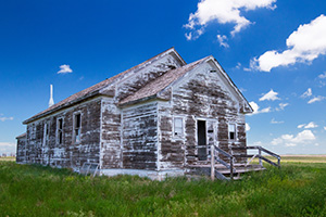 An old abandoned one room schoolhouse sits on the side of the highway near Hemingford, Nebraska. - Nebraska Landscape Photograph