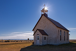 The 1887 Immaculate Conception Catholic Church and Cemetery are all that remain of the Montrose, Nebraska on the wind-swept prairie of the Oglala National Grassland. - Nebraska Photograph