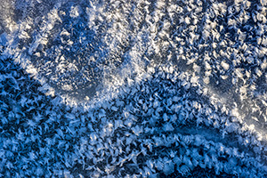 An abstract composition of frost on the ice at Shadow Lake, Nebraska. - Nebraska Close-Up Photograph