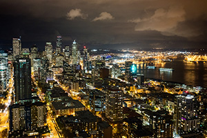 The city of Seattle stretches out into the distance from the vantage of the Space Needle. - Pacific Photograph